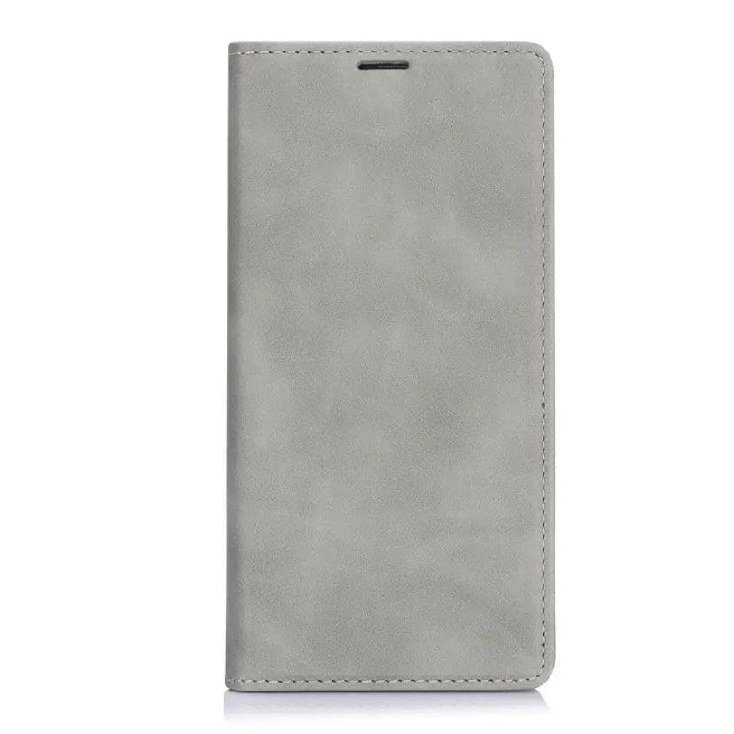 Brown flip case for iPhone 15 Pro Max by 9eight5, showing the front cover and slim design in a natural setting.