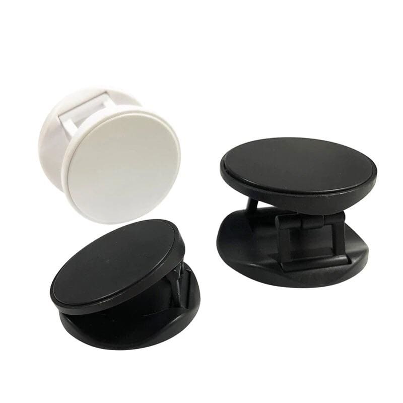 Expanding finger grip with crown design from 9eight5, attached to a phone for secure holding and easy handling.