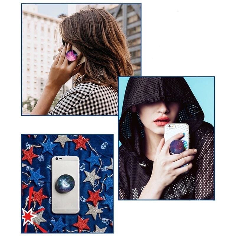 Expanding Finger Grip by 9eight5 with Mystic Grin Wonderland design for phones and tablets, showcasing its adjustable grip feature.