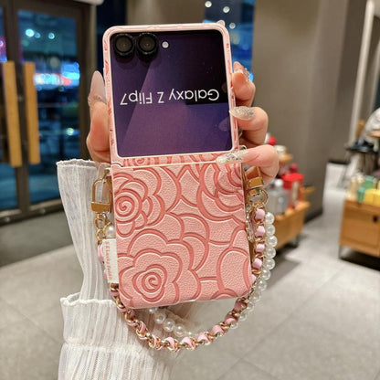 Side Buckle Embossed Camellia Phone Case with Bracelet, For Samsung Galaxy Z Flip7 5G