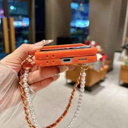 Side Buckle Embossed Camellia Phone Case with Bracelet, For Samsung Galaxy Z Flip7 5G