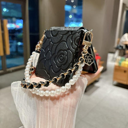 Side Buckle Embossed Camellia Phone Case with Bracelet, For Samsung Galaxy Z Flip7 5G