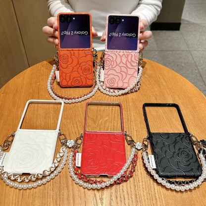 Side Buckle Embossed Camellia Phone Case with Bracelet, For Samsung Galaxy Z Flip7 5G
