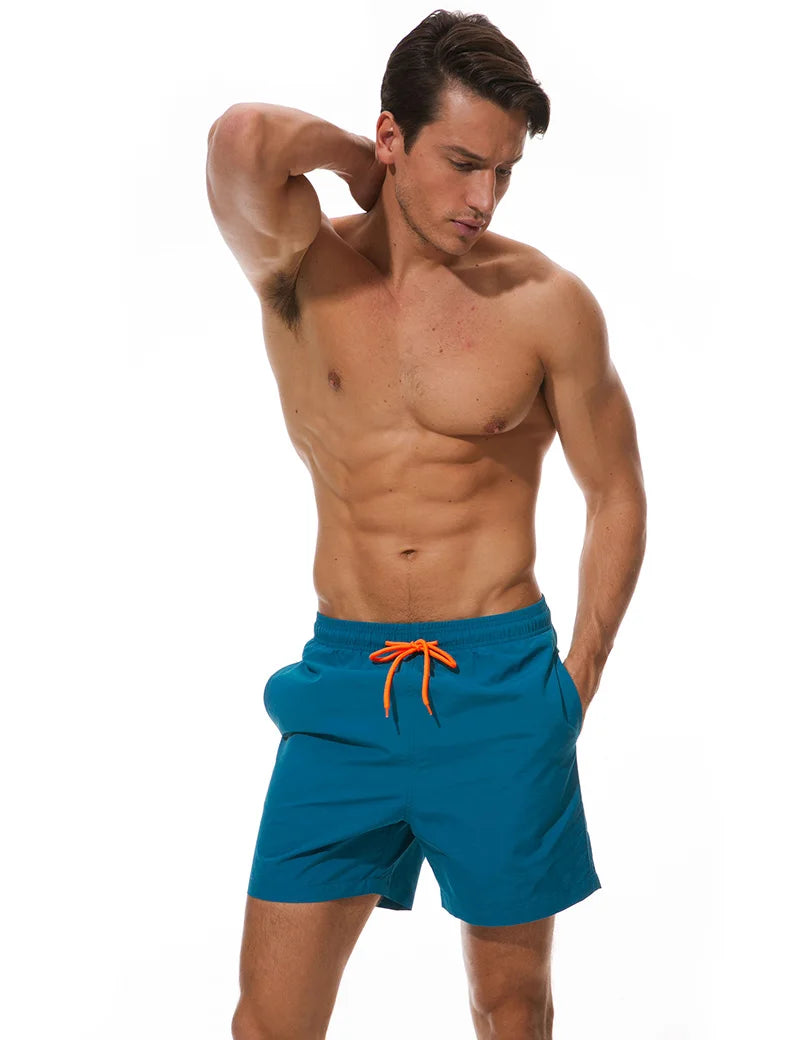 Men's beach boardshorts by ShopHub NZ featuring a sporty surf design, quick-dry fabric, and comfortable fit for swimming and beach activities.