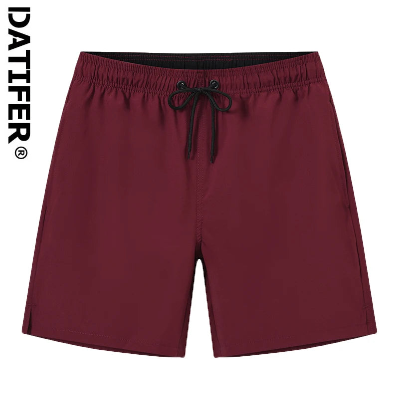 Men's Datifer Summer 2026 gym shorts with mesh liner, zipper pockets, quick-dry fabric, solid color, ideal for beach and swimming.