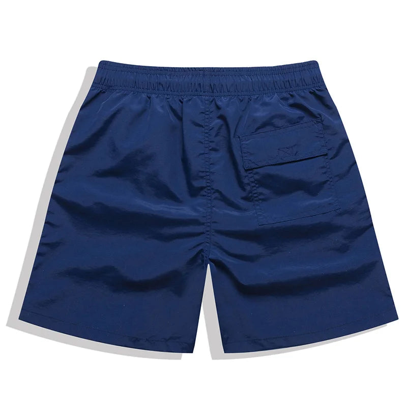 Men's beach boardshorts from ShopHub NZ, stylish surfing swimwear with a comfortable fit, designed for beach and swimming activities.