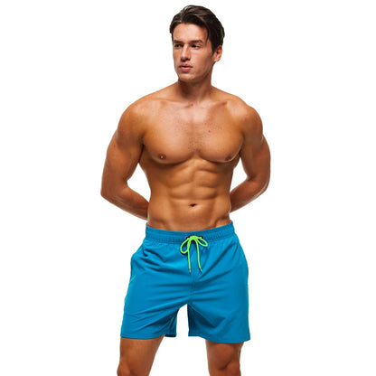 Men's breathable mesh-lined summer boardshorts with zipper pockets, quick-dry fabric, solid color, ideal for beach and swimming.