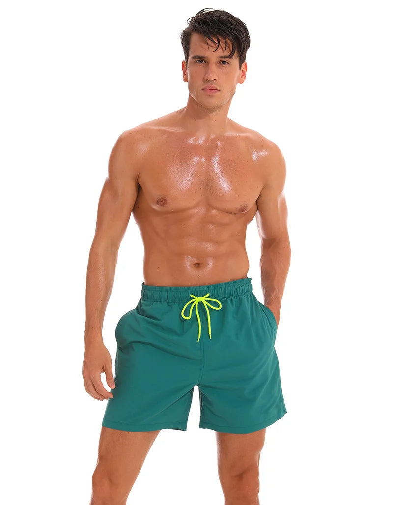 Men's black board shorts from ShopHub NZ featuring quick-dry fabric, sporty fit, and casual beachwear style, size 4XL.