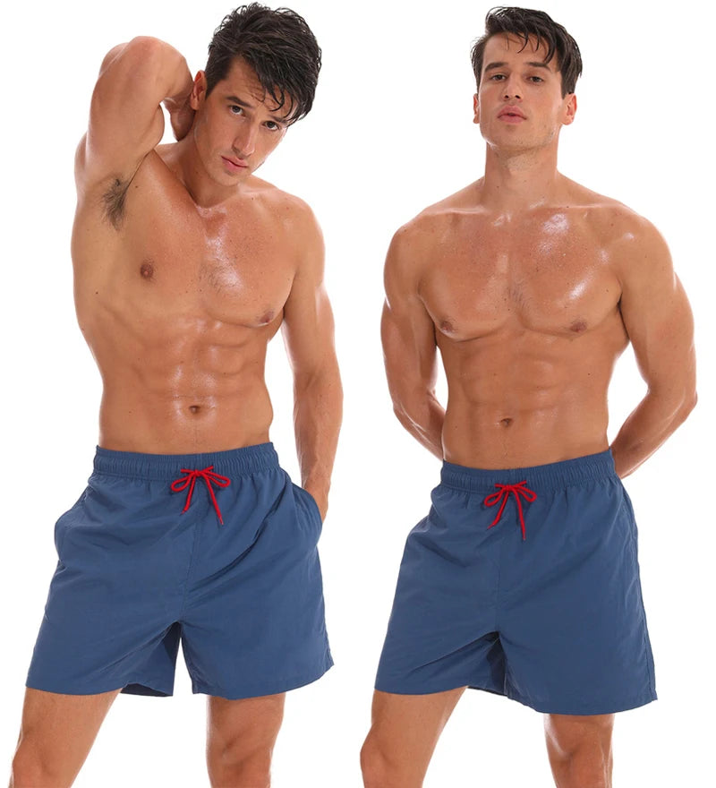 Men's surfboard shorts by ShopHub NZ featuring breathable nylon fabric, mesh liner, and vibrant design for active beachwear.