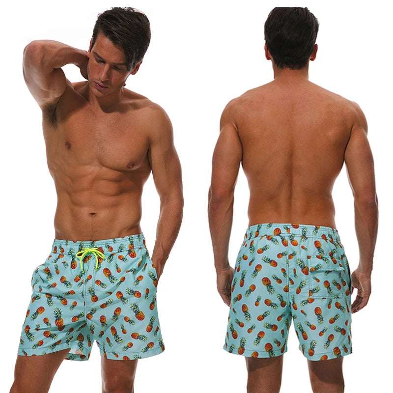 Men's ShopHub NZ sports shorts with vibrant printed polyester design, suitable for beachwear, surfing, swimming, and fitness activities.