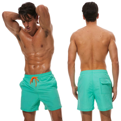 Men's beach boardshorts by ShopHub NZ, surfing swimwear with sporty Bermuda style, lightweight fabric, and vibrant design.