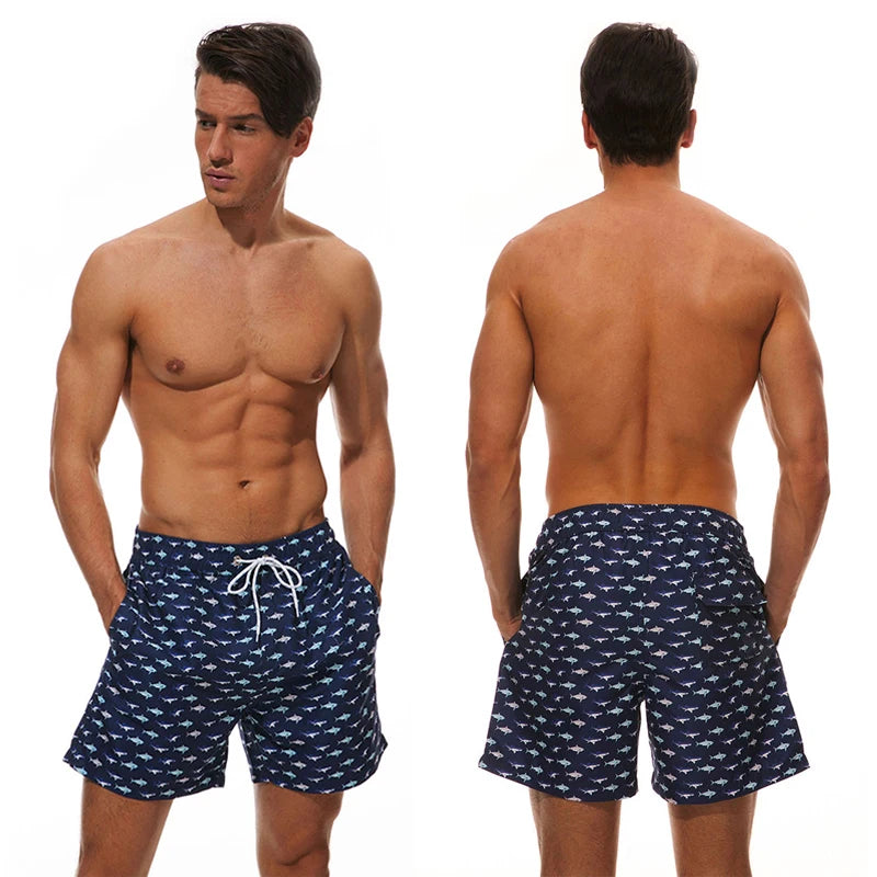 Men’s summer swimming shorts by ShopHub NZ featuring colorful print, polyester fabric, mesh liner, perfect for gym, running, and swimming.
