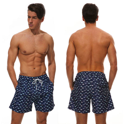 Men’s summer swimming shorts by ShopHub NZ featuring colorful print, polyester fabric, mesh liner, perfect for gym, running, and swimming.