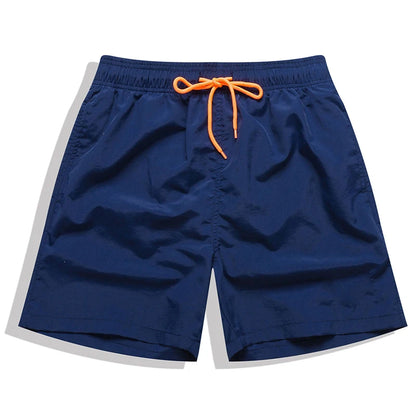 Men's beach boardshorts by ShopHub NZ featuring sporty surfing style, lightweight fabric, and vibrant color for ocean swimming and beach activities.