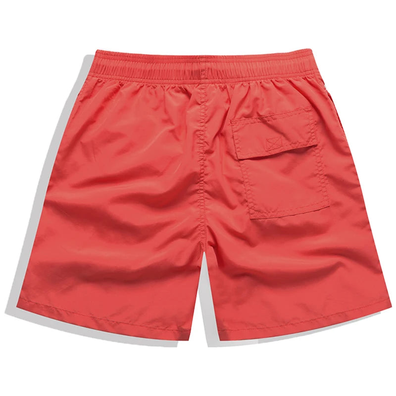 Men's black surfboard shorts by DATIFER 2026 with breathable mesh liner, quick-dry nylon, ideal for swimming and beach sports.