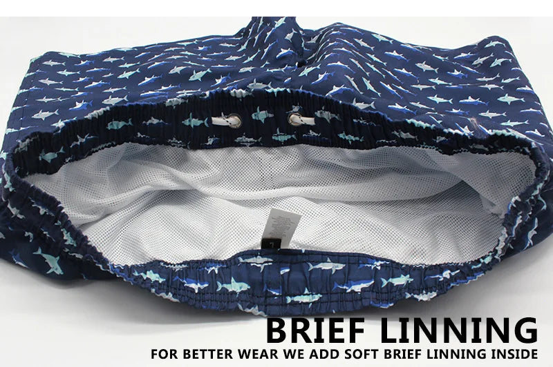Men's summer swimming shorts with colorful print, mesh liner, polyester fabric, ideal for swimming, gym, and sports activities.
