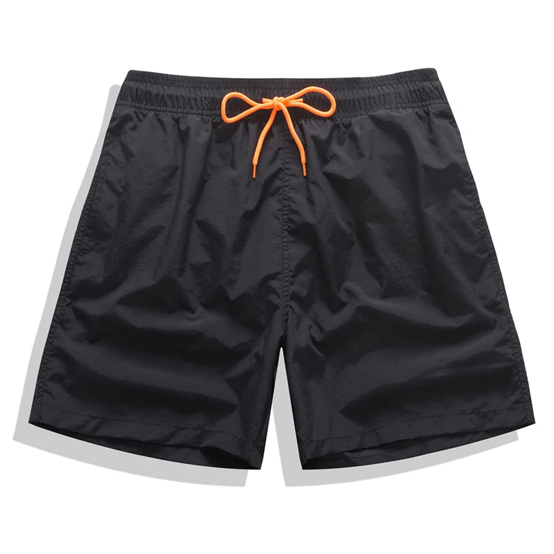 Men's beach boardshorts by ShopHub NZ, stylish surfing swimwear with a comfortable fit and vibrant design for beach and pool.