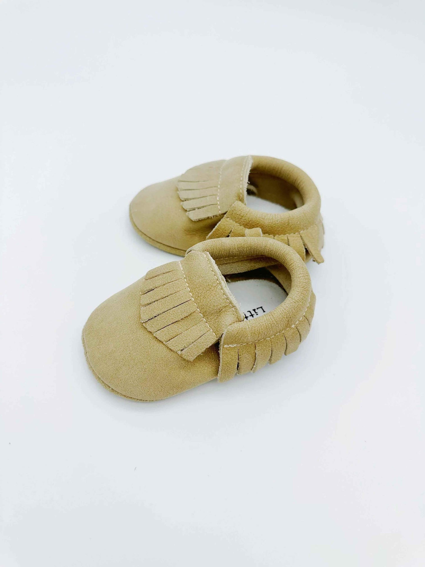 Fringe Beige Baby Leather Flat Shoes