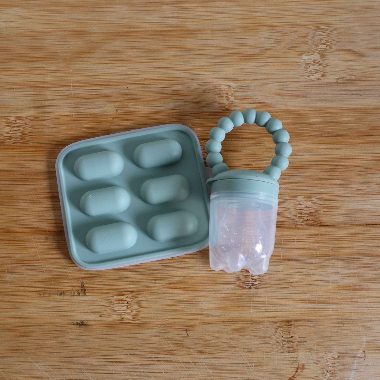 Baby Fruit Feeder  and Tray - Safe Self-Feeding & Teething Relief.
