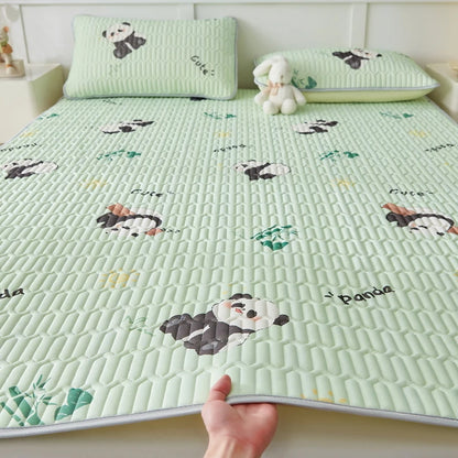 Cooling silk mattress pad set from ShopHub NZ designed for summer comfort, featuring soft, breathable fabric on a plush mattress.