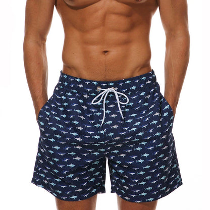 Men's polyester boardshorts with quick-dry fabric, colorful print, mesh liner, suitable for beach surfing and gym activities.