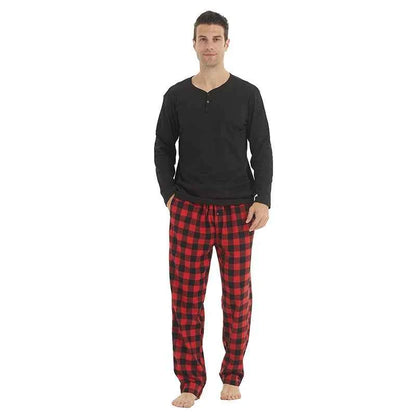 Men's flannel pajama set with plaid pattern, featuring a long-sleeve top and matching pants for cozy evening relaxation.