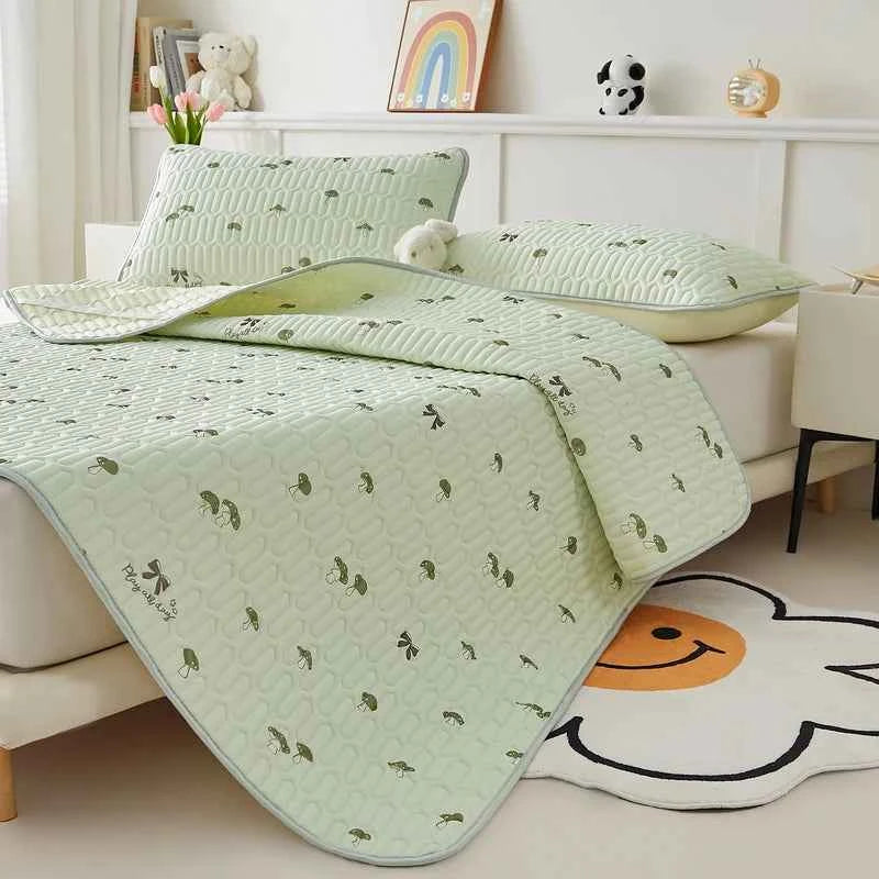 Cooling silk mattress pad set by ShopHub NZ, soft and breathable bedding for summer sleep comfort, shown on a neatly made bed
