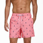 Men's summer boardshorts by ShopHub NZ featuring polyester fabric, vibrant print, quick dry, breathable mesh liner, ideal for surfing and swimming.