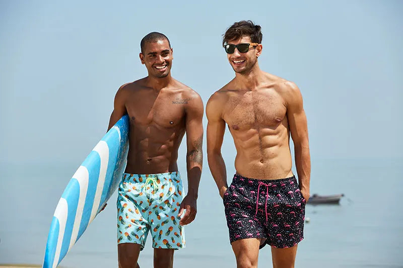 Men's polyester boardshorts with quick-dry fabric, vibrant print, mesh lining, ideal for surfing, beach, and gym activities.