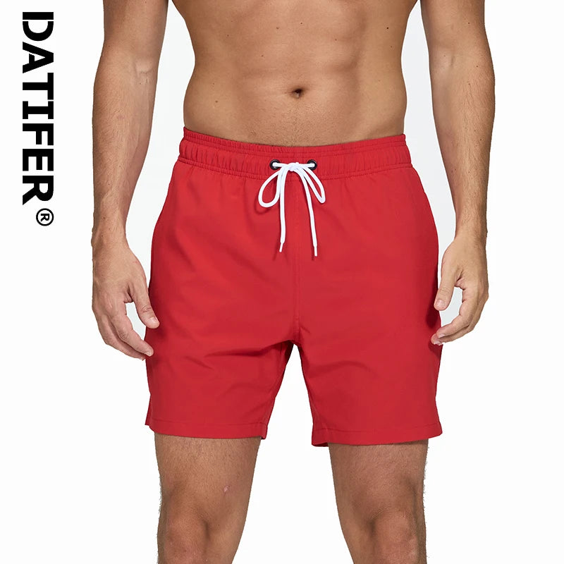 Men's summer boardshorts by ShopHub NZ with breathable mesh lining, zipper pockets, quick-dry fabric, solid design, ideal for beach swimming.
