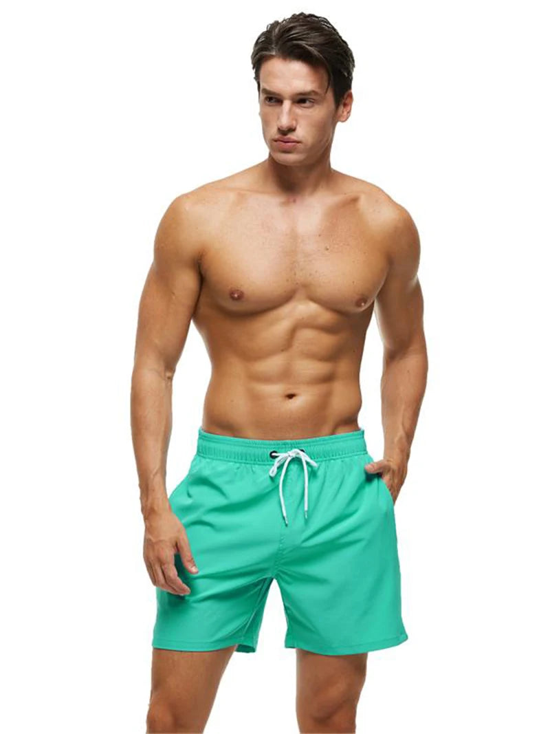 Men's ShopHub NZ summer boardshorts with breathable mesh lining, adjustable waist, zipper pockets, quick-dry fabric, in vibrant colors.