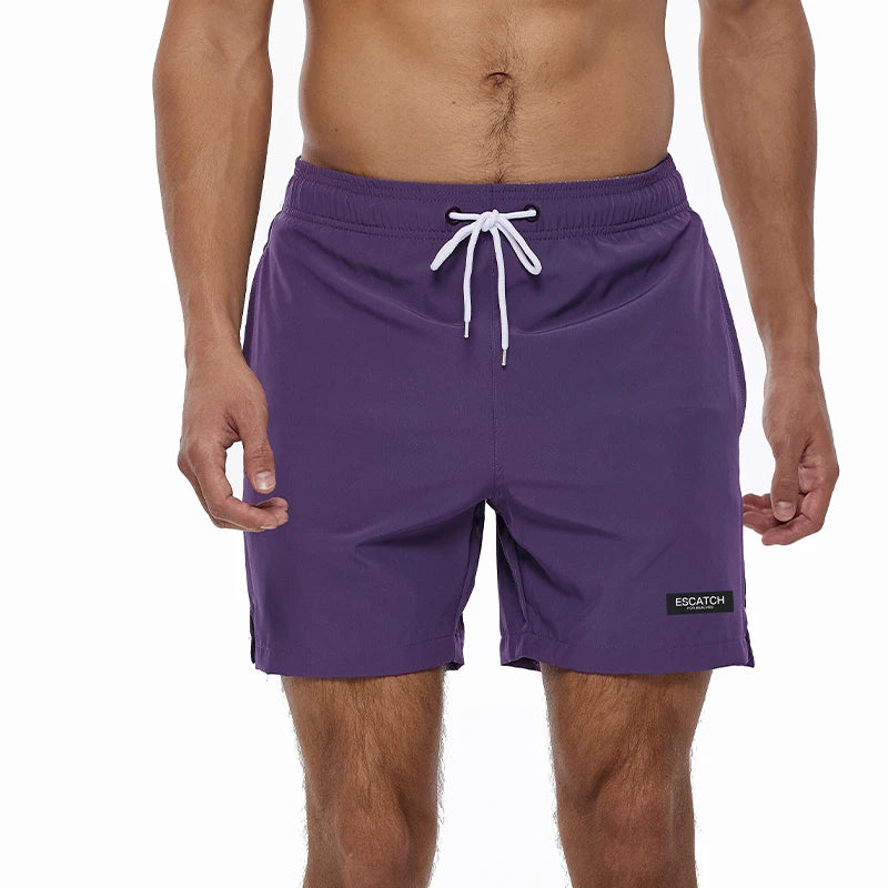 Men's summer swimming shorts by ShopHub NZ, quick-dry polyester with breathable mesh lining and a pocket, ideal for sports and beachwear.