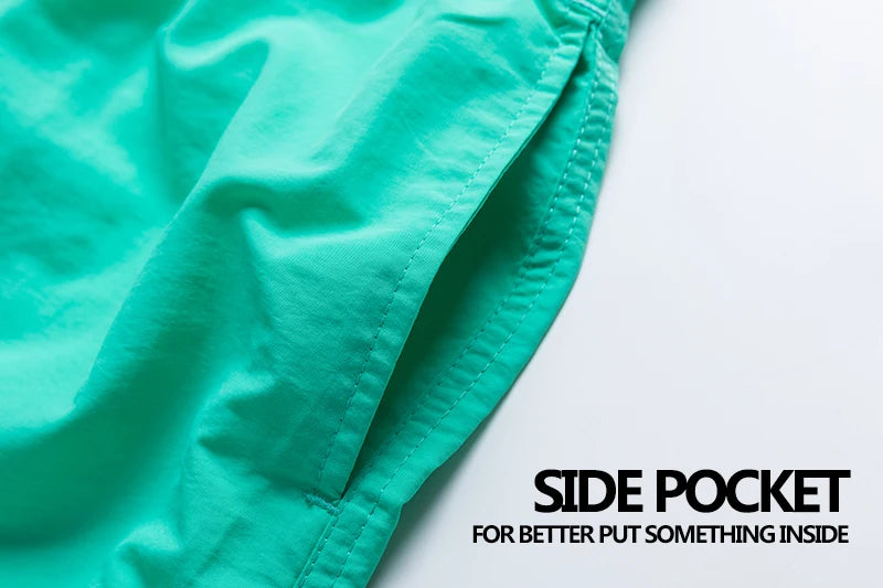 Men's Surf Board Shorts in bright blue with abstract patterns, quick-dry fabric, and elastic waistband, ideal for beach and swimming.