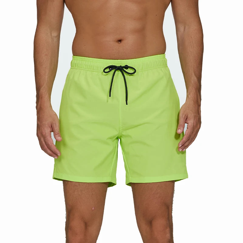 Men's breathable summer boardshorts with zip pockets, quick-dry mesh liner, solid color, ideal for beach and swimwear.