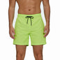 Men's breathable summer boardshorts with zip pockets, quick-dry mesh liner, solid color, ideal for beach and swimwear.