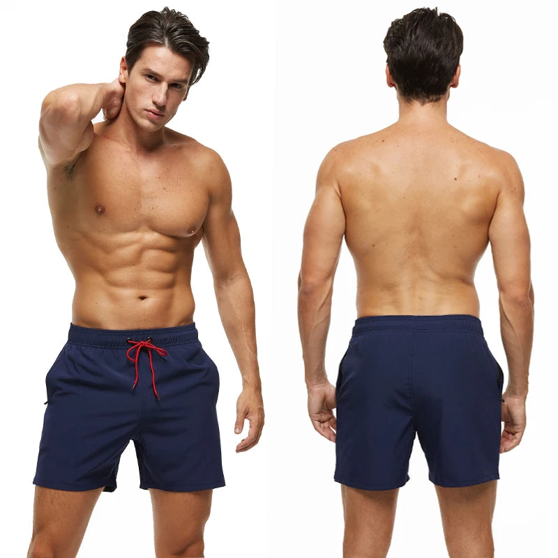Men's breathable mesh liner boardshorts with zipper pockets, quick-dry fabric, solid color, ideal for beach and swimwear.