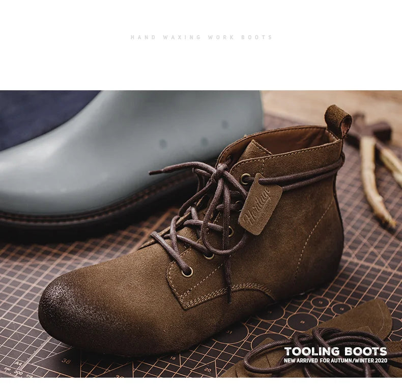 Brown tooling boot with brand tag on a textured surface, with tools in the background.