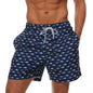 Men's polyester boardshorts with colorful surfing print, ideal for beachwear, swimming, and fitness activities.