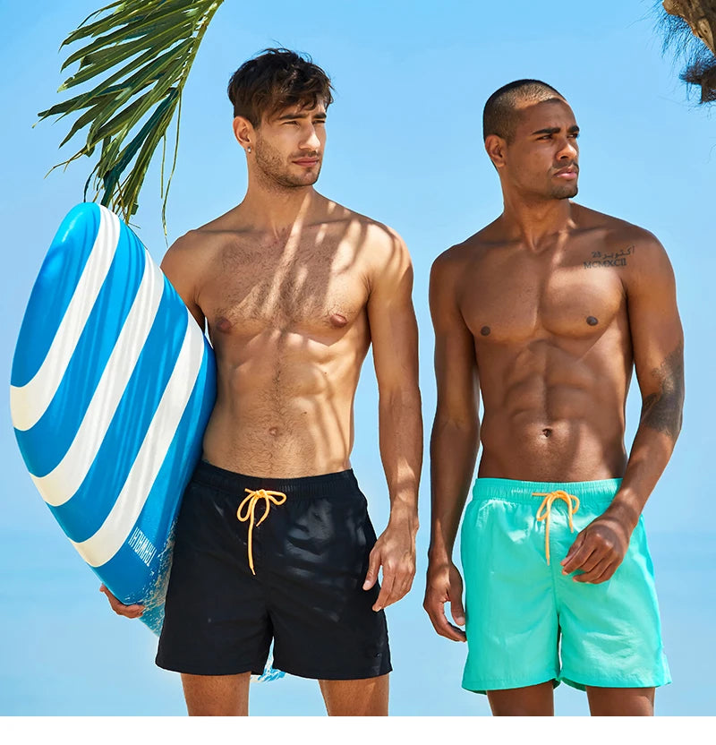 Men's summer boardshorts with nylon material, solid color, mesh liner, drawstring waist, ideal for surfing and sports.