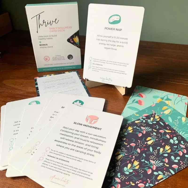 Thrive Daily Wellness Card Deck for Kids aged 9+ by Awesome Inc NZ, showing colorful cards with positive prompts and illustrations.