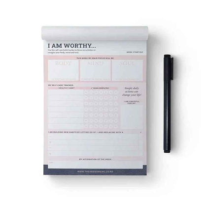 Self-care habit tracker notepad by Awesome Inc NZ with "I Am Worthy" message, designed for tracking daily self-care routines.