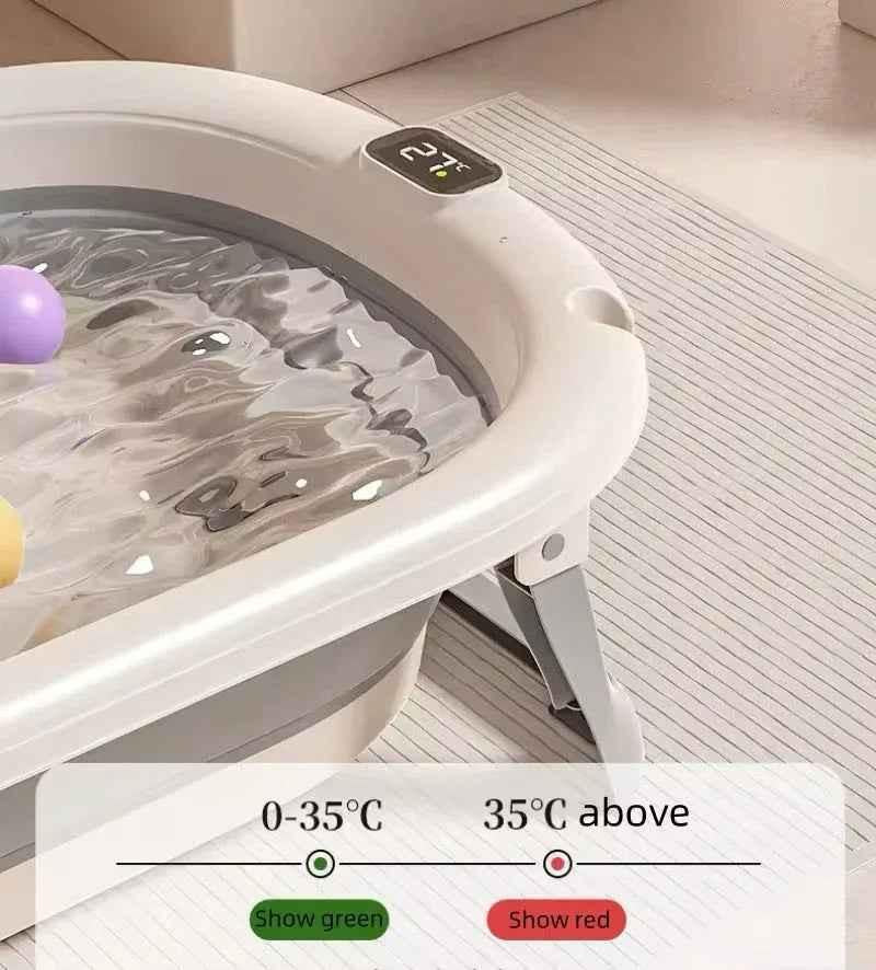 Foldable Baby Bath with digital thermometer and newborn support rack in grey, designed for safe and convenient bathing by Baby Way NZ.