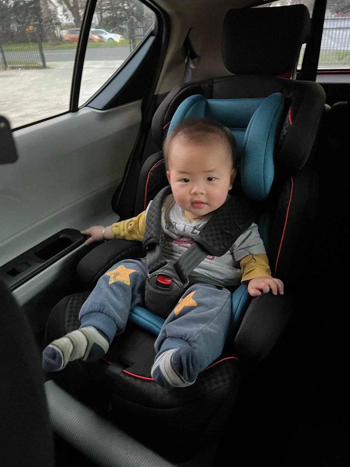 Baby Way NZ The Racer car seat booster with adjustable headrest, black booster seat for safe, comfortable child riding support.