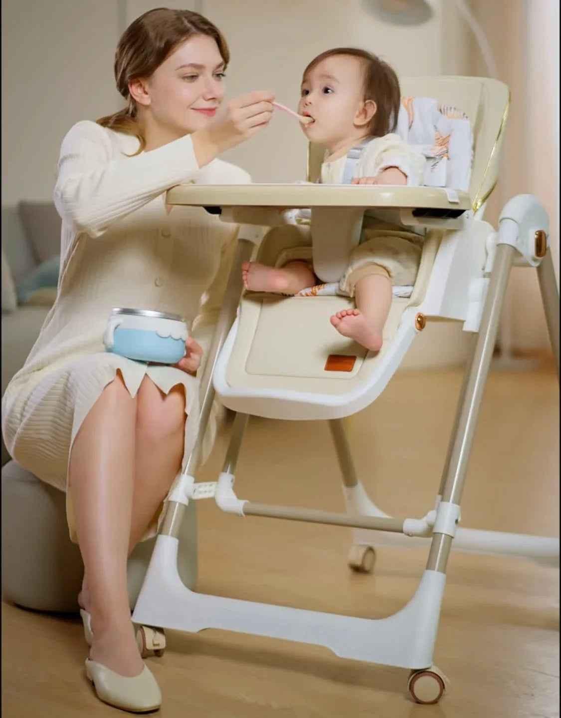 Jupiter Beige 2-in-1 high chair and swing by Baby Way NZ, showing a versatile beige high chair with swing features.