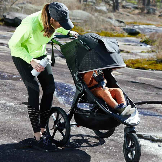 Baby Jogger Summit X3 jogging stroller in Midnight Black with adjustable handlebar and sturdy wheels for active families.