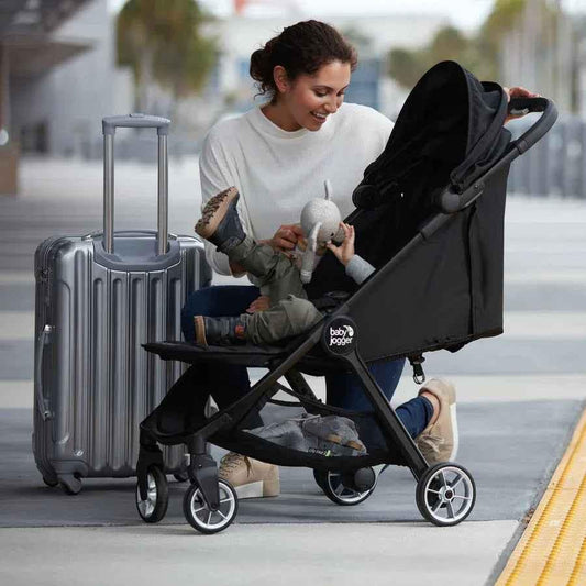 Baby Jogger City Tour 2 Compact Travel Stroller in Pitch Black, a lightweight travel system for infants and toddlers.
