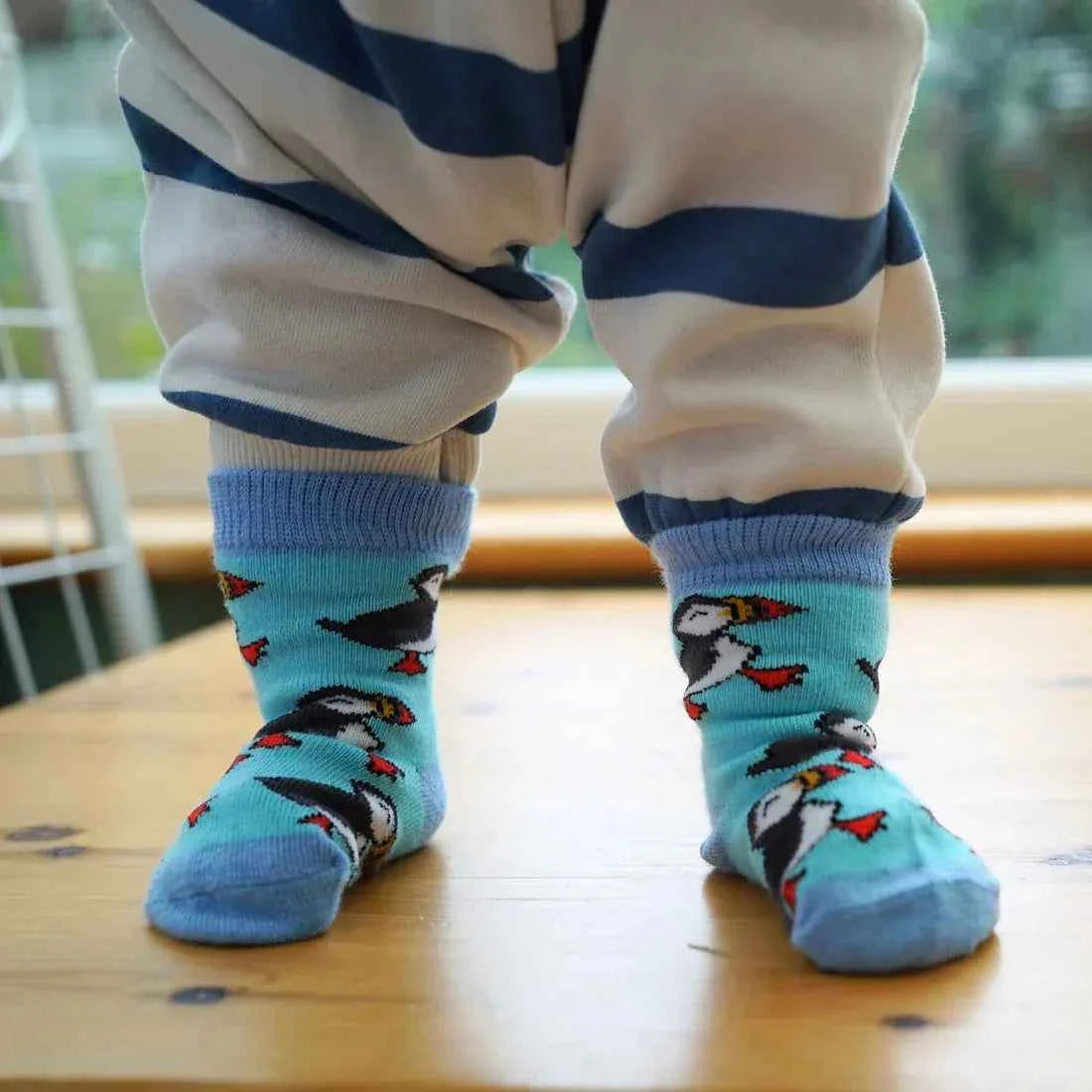 Barekind NZ bamboo socks for kids featuring colorful puffin design, suitable for ages 0-12 months.