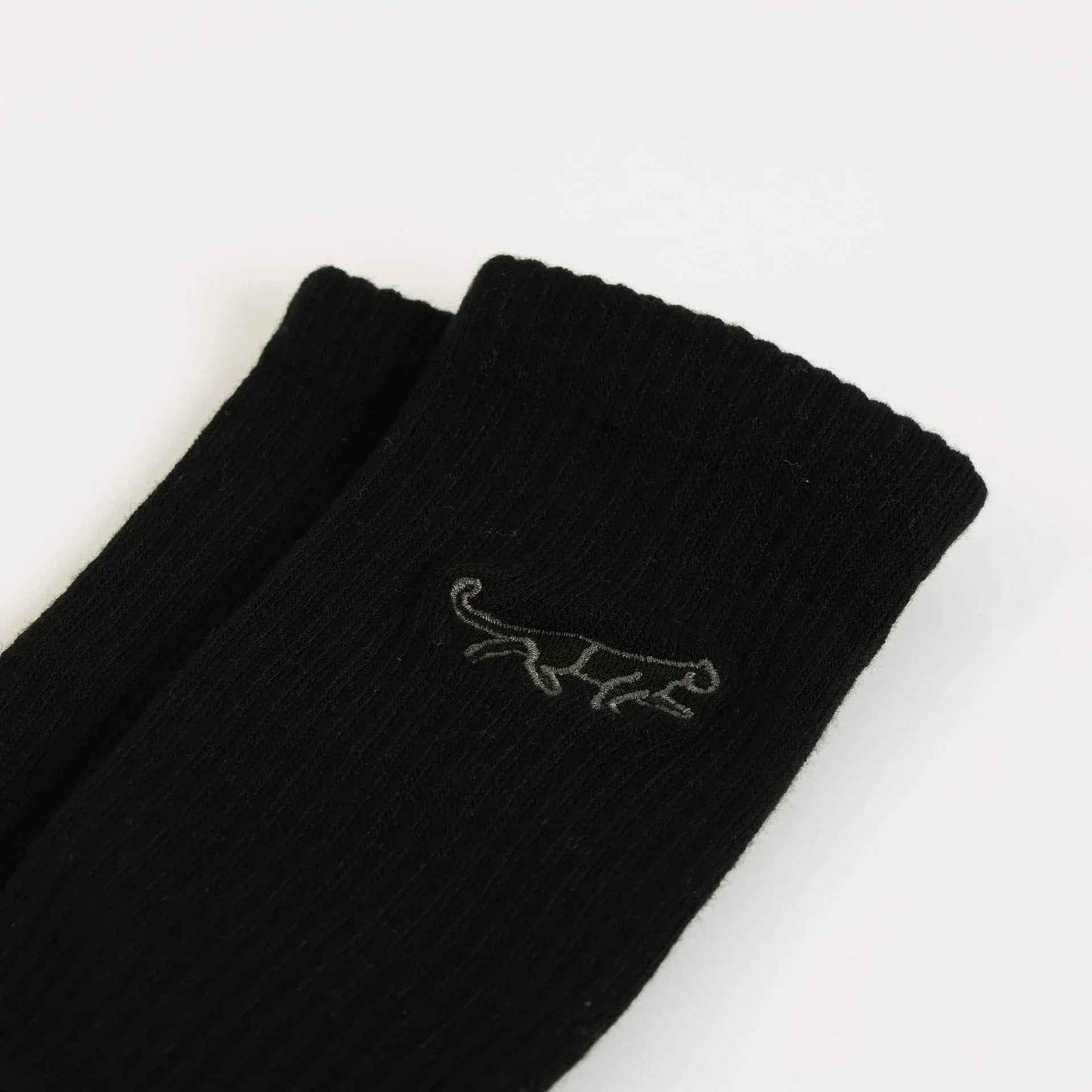 Barekind NZ black and white ribbed bamboo socks for adults, featuring a Save the Black Panthers design.