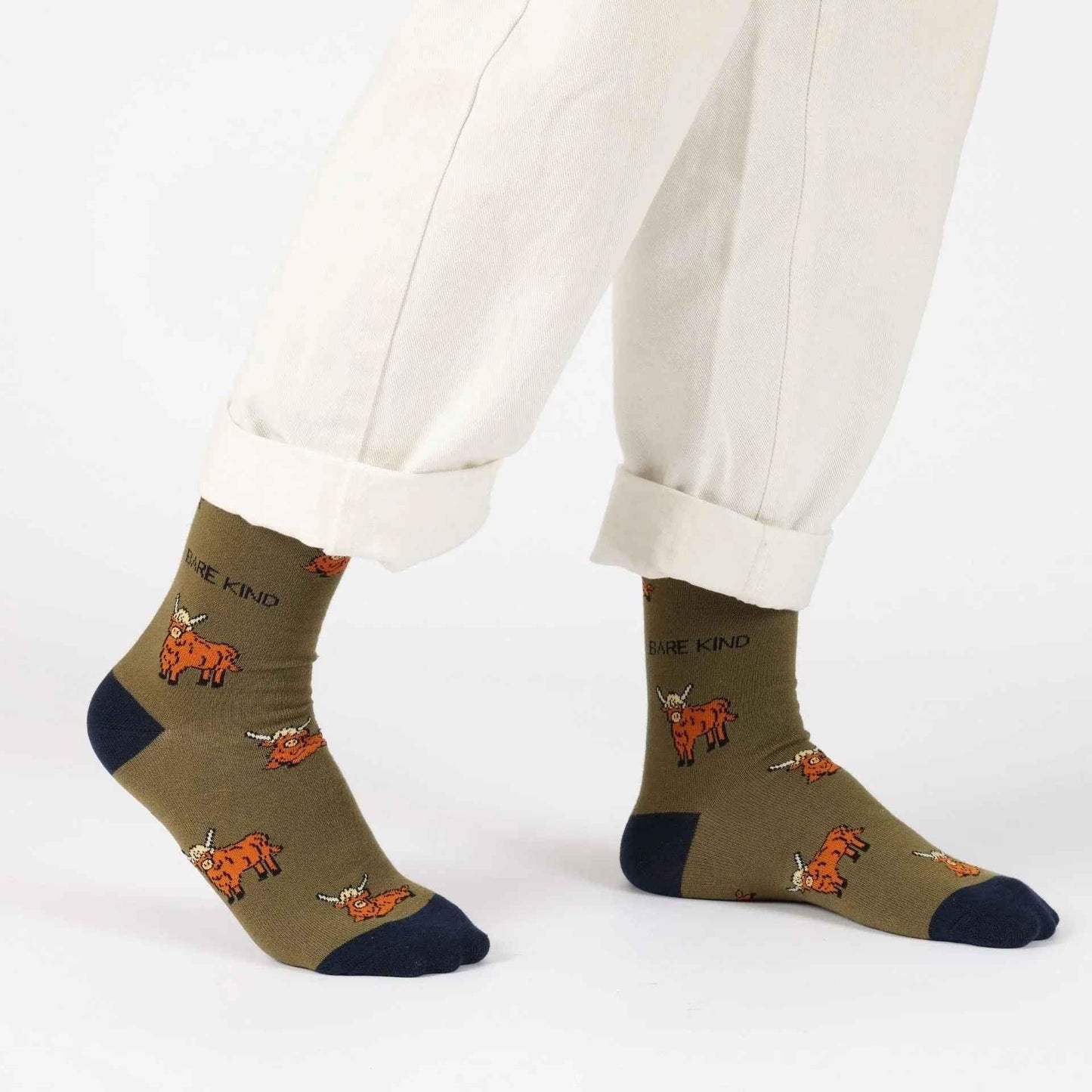 Barekind NZ bamboo socks featuring a green Highland Cow design, comfortable adult socks for everyday wear.