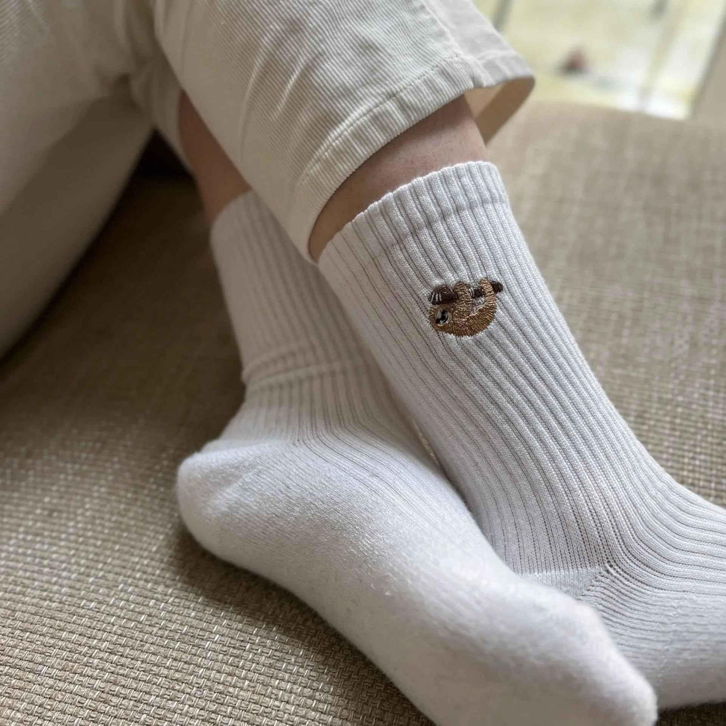 Barekind NZ Save the Sloths ribbed bamboo socks for adults, featuring a comfortable design with sloth-themed patterns.